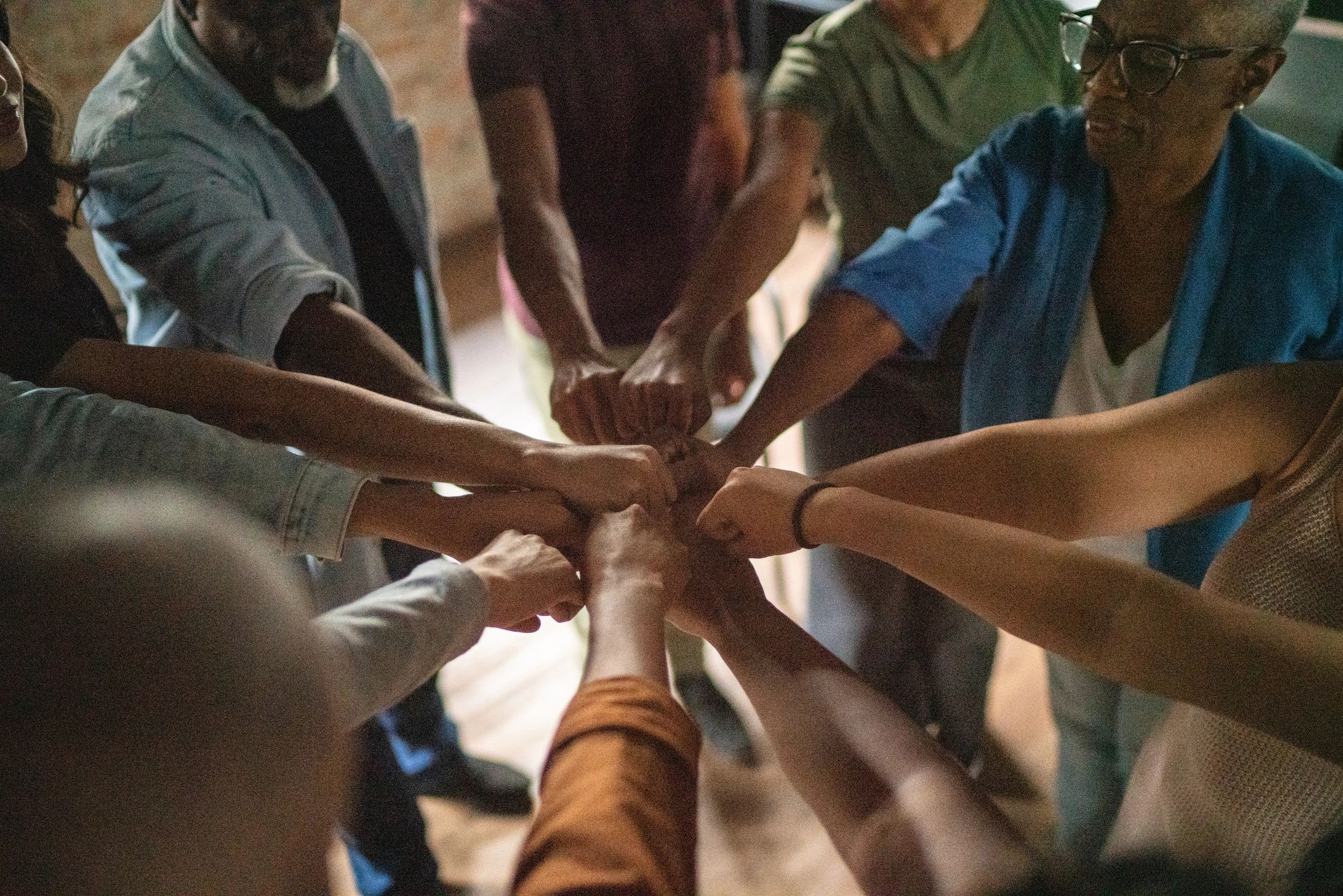 Team hands together in a huddle