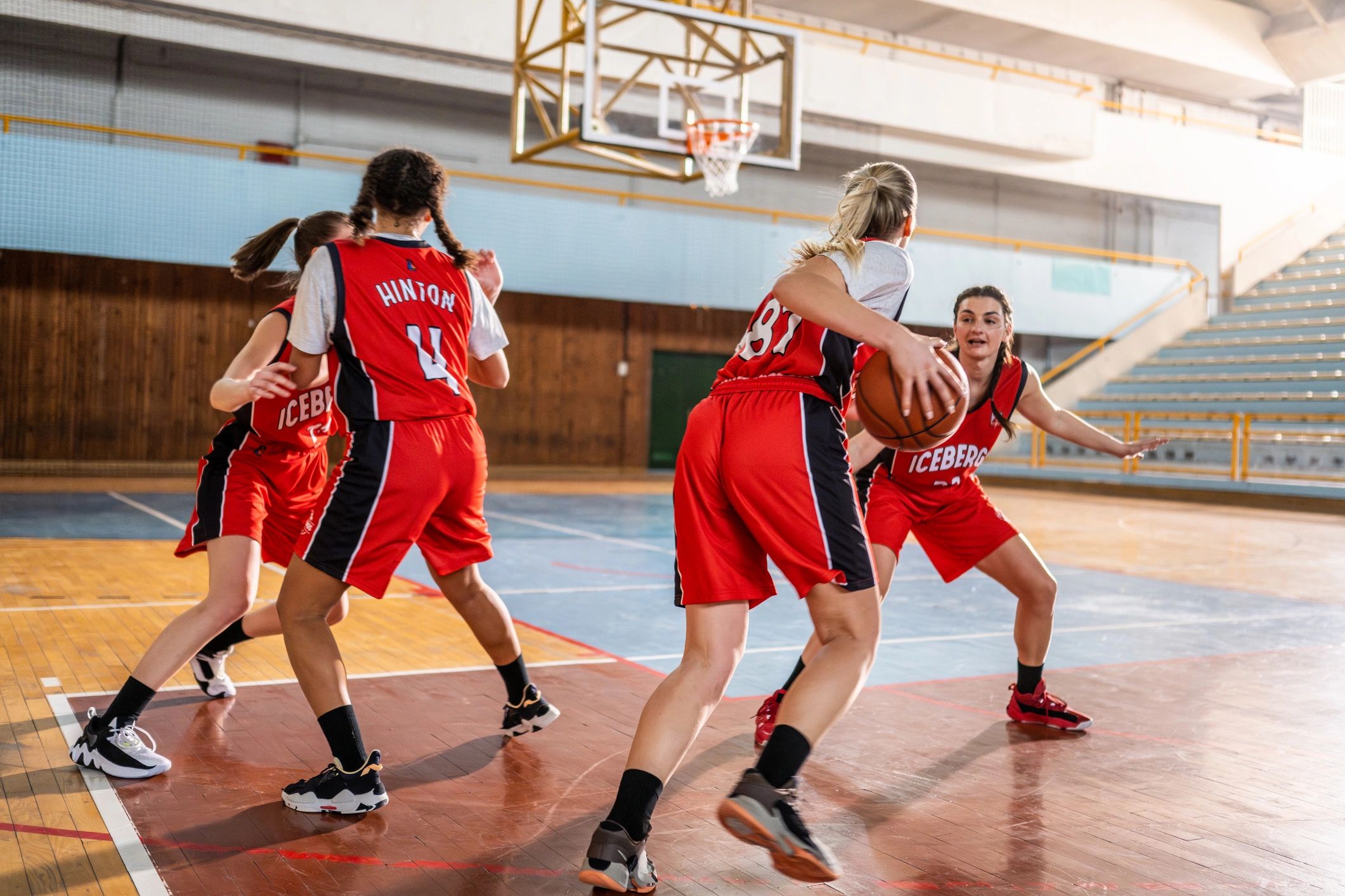 Youth basketball team training on an indoor court
